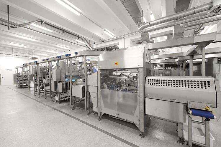 Close-up of a stainless-steel packaging machine in the pretzel production area