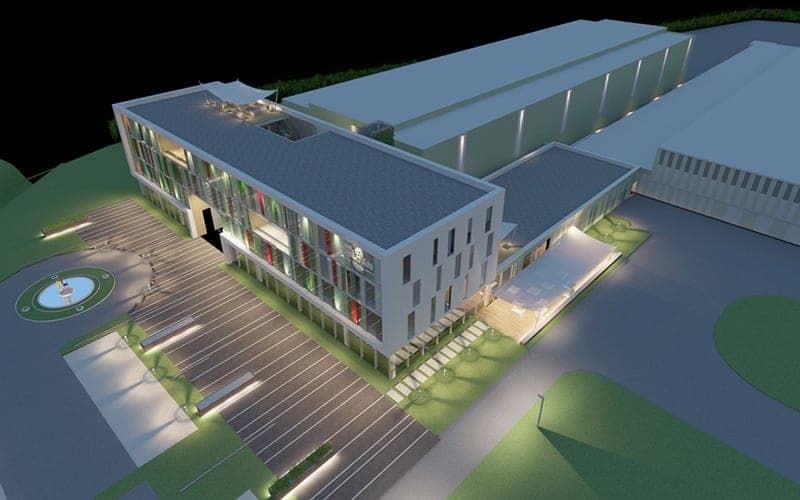 Night-time bird's-eye visualisation of the illuminated administration building with car park and fountain