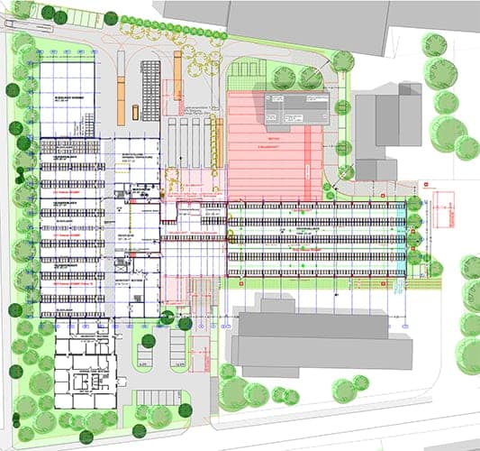 Site plan with the ground floor of the high-bay warehouse and existing buildings, traffic areas and trees