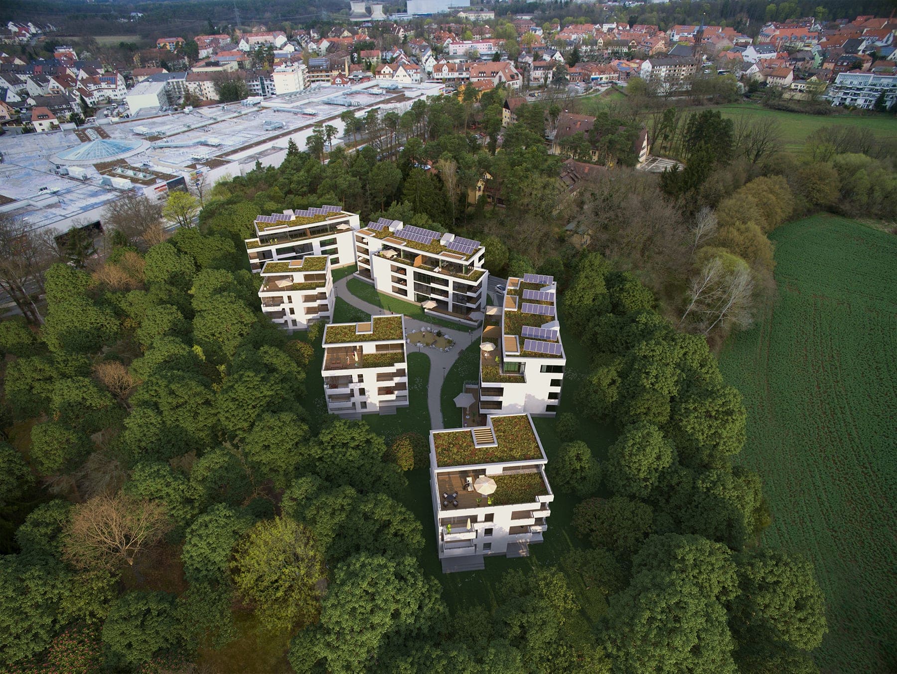 Residential development by the Wiesengrund in Stein bei Nuremberg, aerial visualisation of six buildings among trees